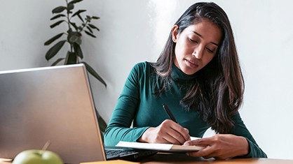 Person writing a press release.